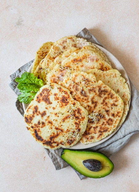 Fresh naan bread with avocado and sprouts Traditional homemade wheat flour flatbread