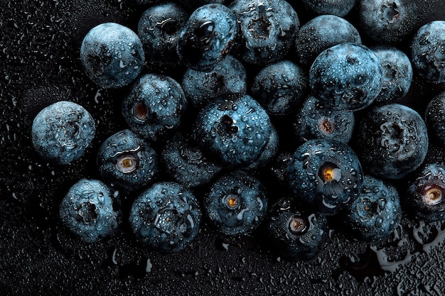 Fresh natural antioxidant blueberries pile, macro detailed close up.