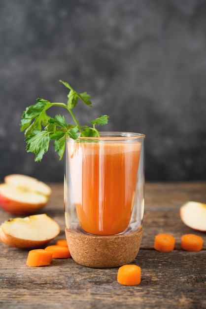 Fresh natural apple carrot juice in a glass glass