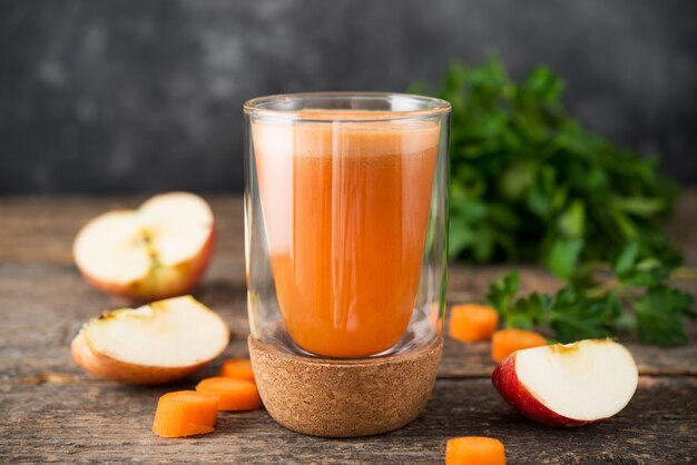 Fresh natural apple carrot juice in a glass glass