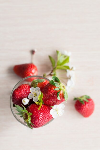 Fresh natural strawberries on a light surface