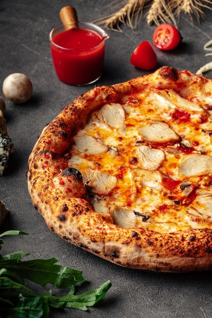 Fresh neopolitan chicken pizza on grey background