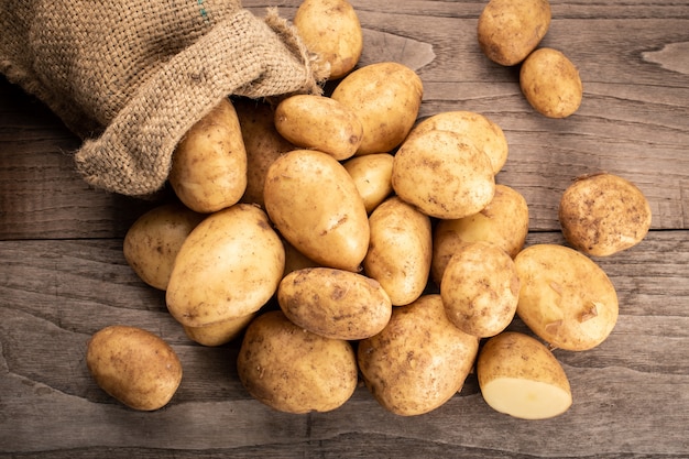 Fresh new potatoes on wooden 