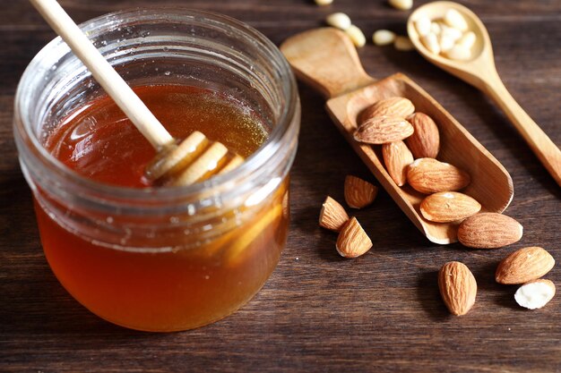 Fresh nuts on the table for breakfast with honey and cake