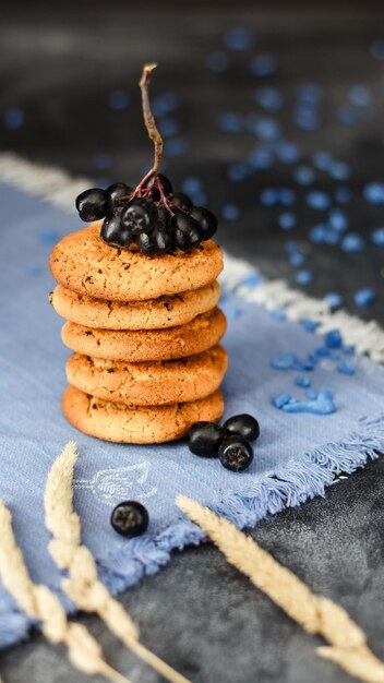 Fresh oatmeal cookies on a dark background