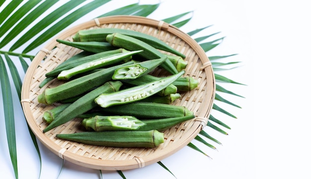 Fresh okra in round bamboo basket