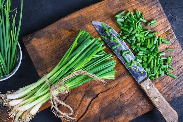 Fresh onion cut on wooden chopping board