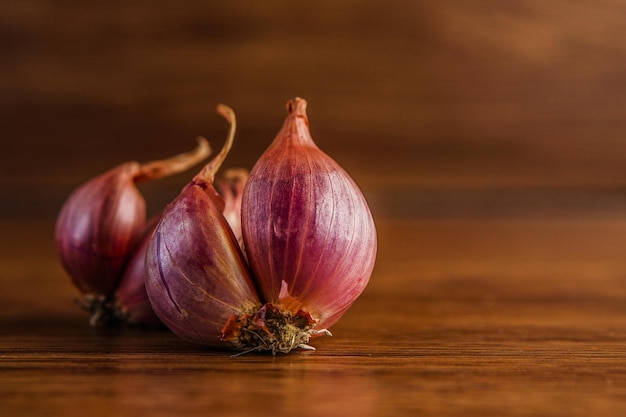 Fresh onion on a wooden table