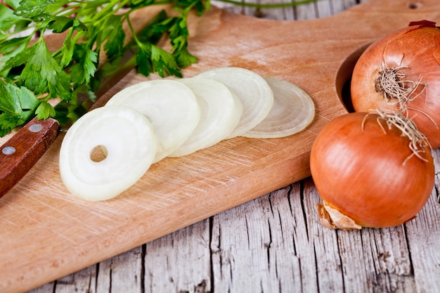 Fresh onions, knife and parsley 