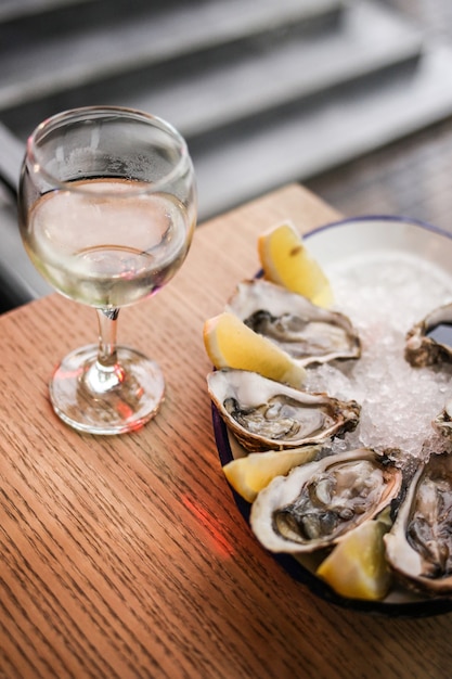 Fresh open oysters and white wine in a restaurant