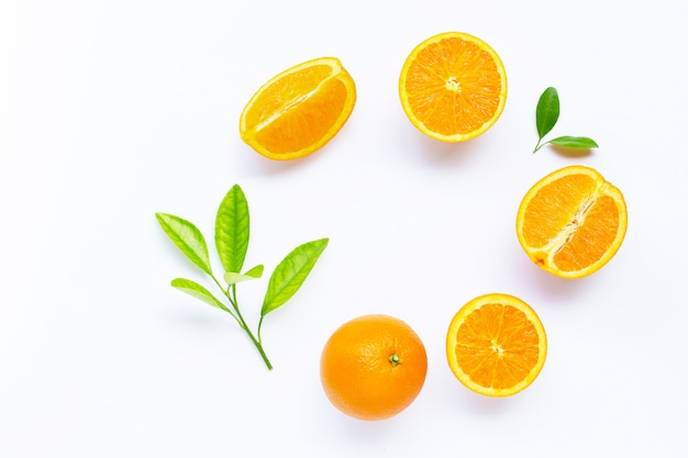 Fresh orange citrus fruit with leaves isolated on white background.