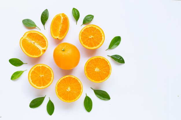 Fresh orange citrus fruit with leaves isolated on white background.