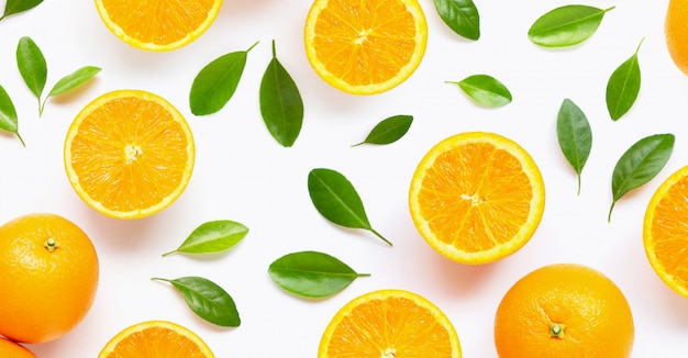 Fresh orange citrus fruit with leaves isolated on white.