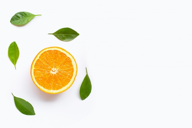 Fresh orange citrus fruit with leaves isolated on white