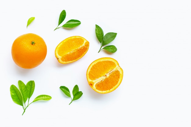 Fresh orange citrus fruit with leaves isolated on white