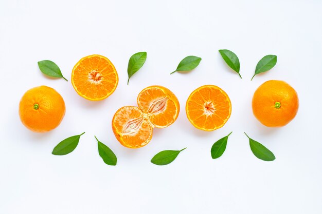 Fresh orange citrus fruit with leaves isolated