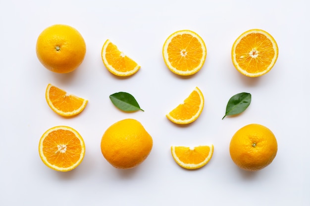 Fresh orange citrus fruits with leaves on white 