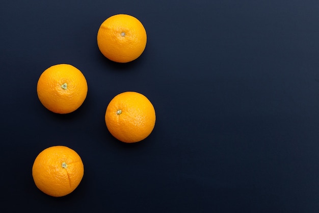 Fresh orange fruit on dark