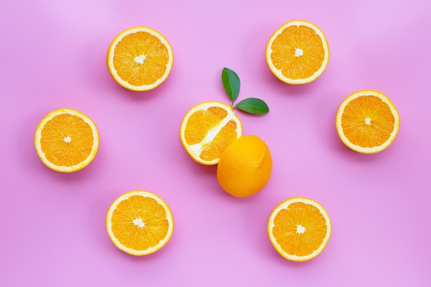 Fresh orange fruit on pink