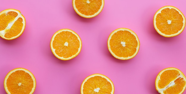 Fresh orange fruit on pink