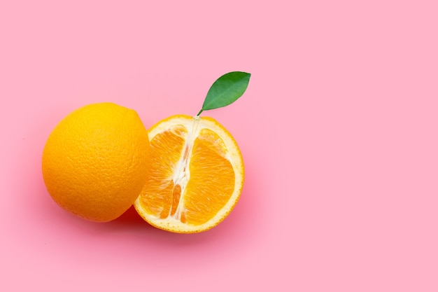 Fresh orange fruit on pink