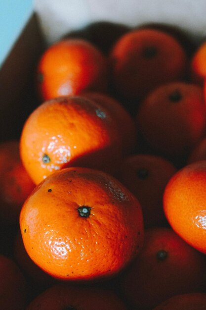 Fresh orange fruit with leaves citrusy and vibrant highresolution studio image