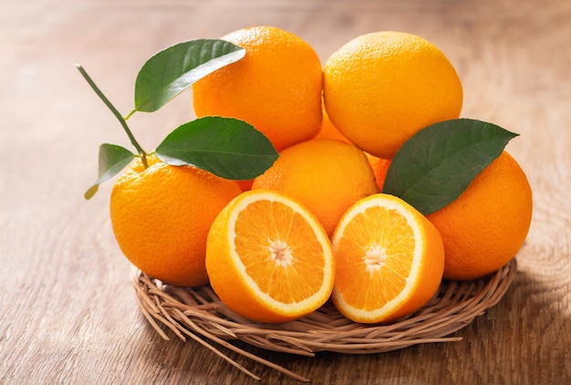 fresh orange fruits on wooden table