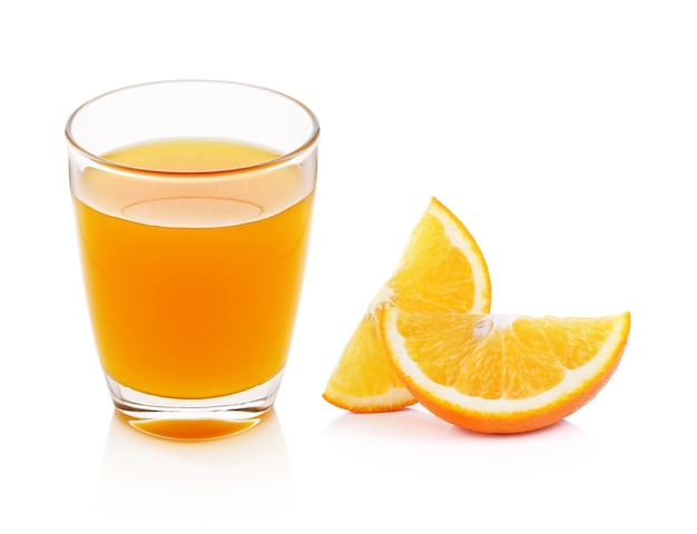 Fresh orange and glass with juice on white background.