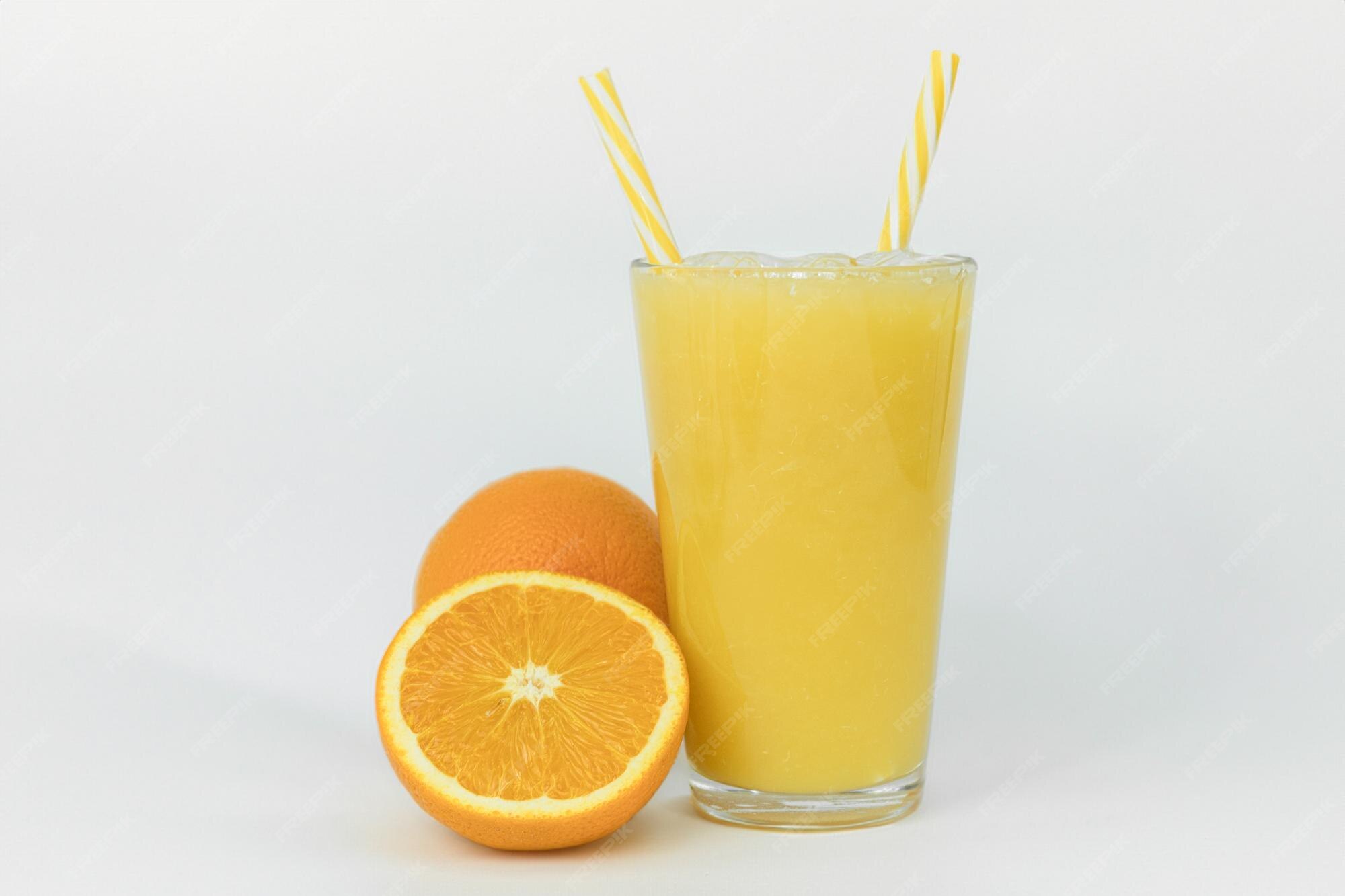 Premium Photo Fresh orange juice on the kitchen table orange juice in