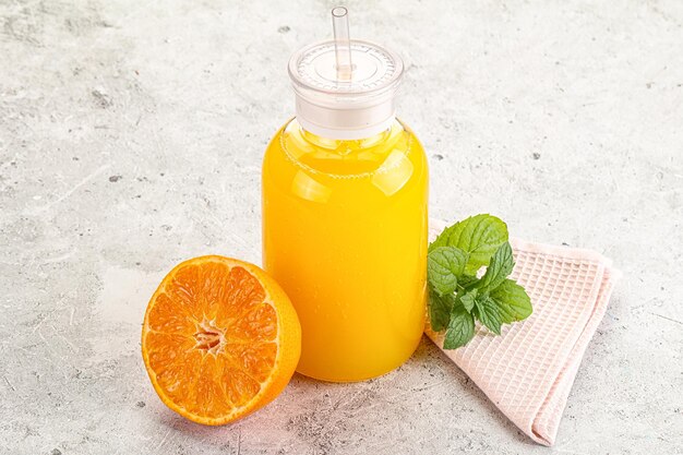 Fresh orange juice served mint and half fruit