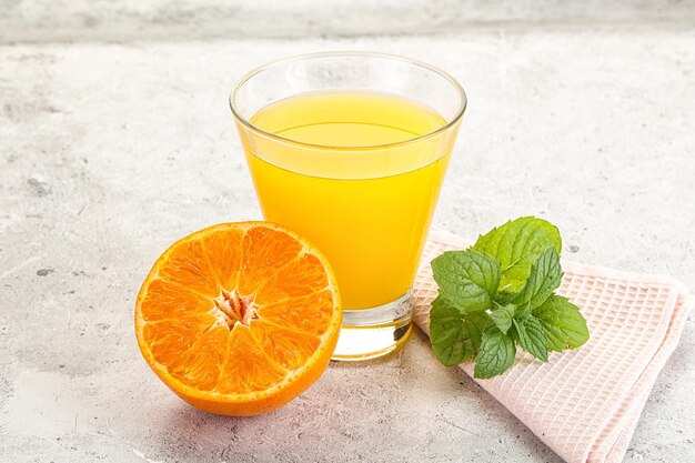 Fresh orange juice served mint and half fruit