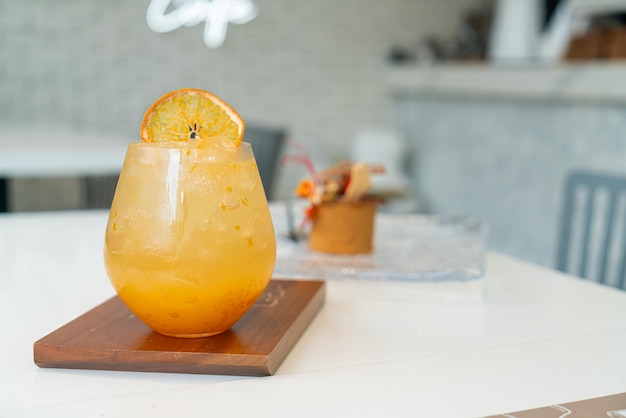 fresh orange juice with soda on table