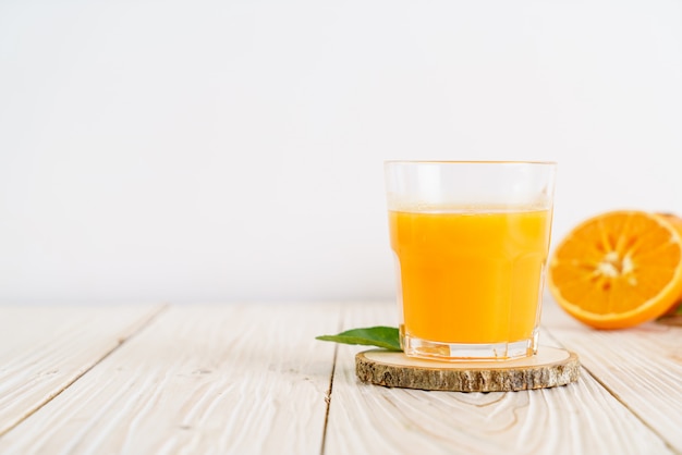 Fresh orange juice on wood table