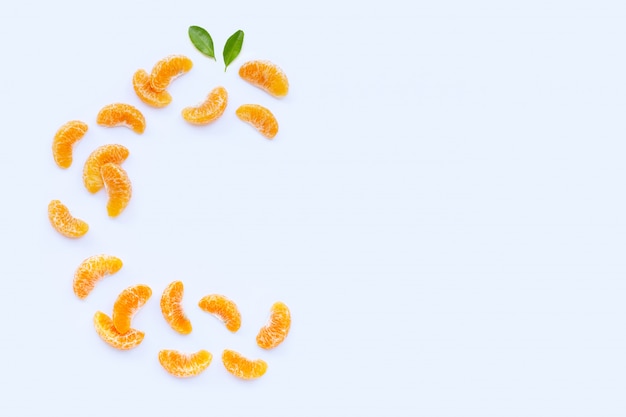 Fresh orange segments, High vitamin C, Letter C made of citrus fruits on white background.