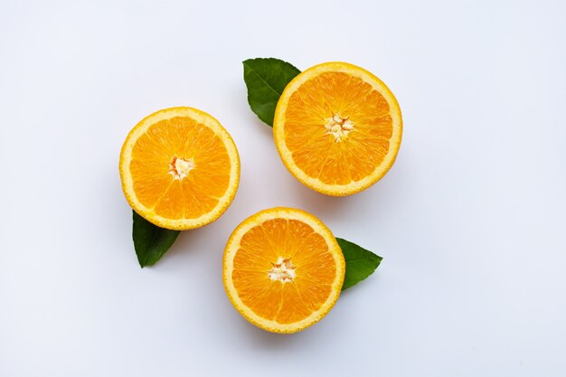 Fresh orange with leaves isolated on white background.  