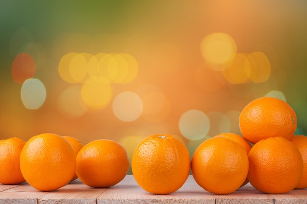 Fresh orange on wood with blur bokeh background