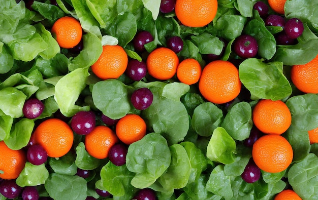 Fresh oranges and green leaves