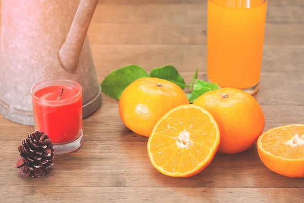 Fresh oranges and juice in glass