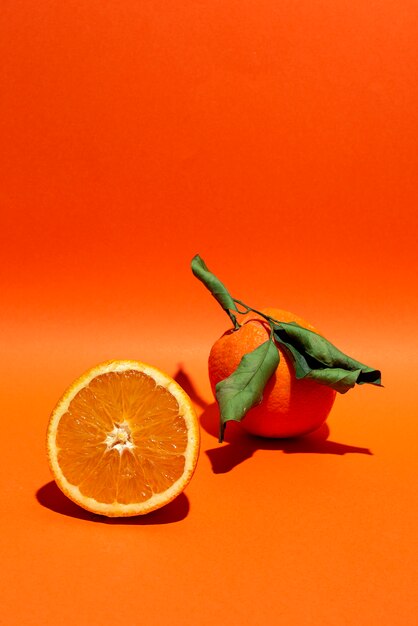 Fresh Oranges on orange background