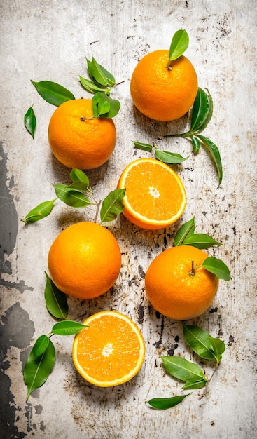 Fresh oranges with leaves.