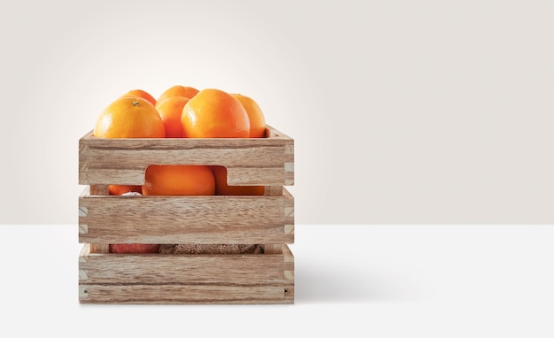 Fresh oranges in a wooden box