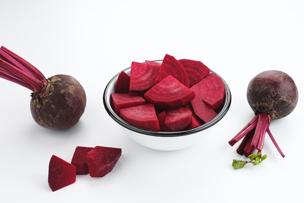 Fresh Organic Beetroot Slices served in a bowl on a white background.