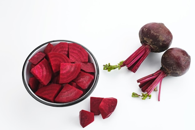 Fresh Organic Beetroot Slices served in a bowl on a white background.