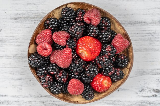 Fresh organic blackberries strawberries and raspberries close up Top view blackberry strawberry and raspberry