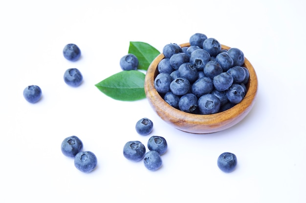 Fresh organic blueberries in bowl on white background Healthy summer eating concept and lifestyle