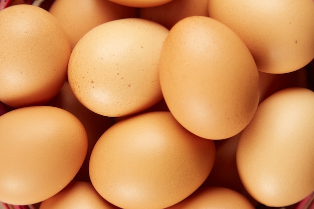 Fresh organic brown eggs extreme close up