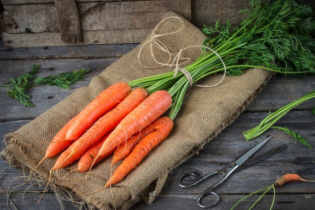 Fresh Organic Carrots  on rustic  table