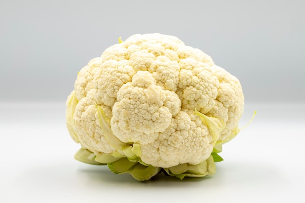 Fresh organic cauliflower on a white background with shadow close up