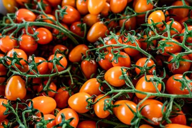 Fresh organic cherry tomatoes as background