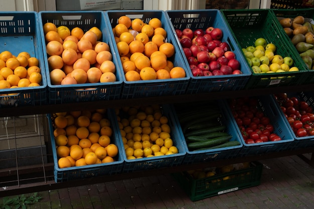 Fresh organic fruits and vegetables sold on market shelves in Amsterdam